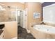 Bathroom featuring a soaking tub and tiled walk-in shower at 4991 Sound View Dr, Mount Pleasant, SC 29466