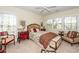 Charming bedroom with natural light and floral bedding, complemented by unique furniture at 4991 Sound View Dr, Mount Pleasant, SC 29466