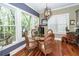 Dining area with a glass table, wicker chairs, and large windows offering natural light at 4991 Sound View Dr, Mount Pleasant, SC 29466