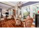 Dining area with hardwood floors, a round table, and a view through large windows at 4991 Sound View Dr, Mount Pleasant, SC 29466