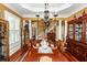 Elegant dining room with hardwood floors, statement chandelier, and seating for six at 4991 Sound View Dr, Mount Pleasant, SC 29466