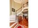 Grand two-story foyer with hardwood floors, a staircase, and elegant decor at 4991 Sound View Dr, Mount Pleasant, SC 29466