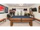Spacious game room features a pool table, pinball machine, and French doors leading to outdoor scenery at 4991 Sound View Dr, Mount Pleasant, SC 29466