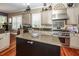 Bright kitchen featuring granite countertops, stainless steel appliances, and a large island for food preparation at 4991 Sound View Dr, Mount Pleasant, SC 29466