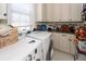 Bright laundry room with ample storage cabinets and modern appliances at 4991 Sound View Dr, Mount Pleasant, SC 29466