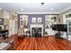 Open living space showcasing the fireplace, shelving, and bright hardwood flooring at 4991 Sound View Dr, Mount Pleasant, SC 29466