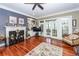 Bright living area with fireplace, French doors, and an elegant chair at 4991 Sound View Dr, Mount Pleasant, SC 29466