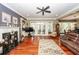 Bright living room featuring hardwood floors, a decorative fireplace, and French doors to outdoor space at 4991 Sound View Dr, Mount Pleasant, SC 29466