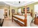 Cozy main bedroom featuring a four-poster bed and comfortable carpeting at 4991 Sound View Dr, Mount Pleasant, SC 29466