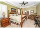 Serene main bedroom with a four-poster bed and French doors to a sitting area at 4991 Sound View Dr, Mount Pleasant, SC 29466