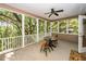 Relaxing screened porch offers serene outdoor views and comfortable seating arrangement for outdoor enjoyment at 4991 Sound View Dr, Mount Pleasant, SC 29466