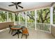 Enclosed porch with table, chairs, and view of trees at 4991 Sound View Dr, Mount Pleasant, SC 29466