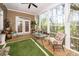 Inviting sunroom with a ceiling fan, large windows providing natural light and beautiful views of the outdoors at 4991 Sound View Dr, Mount Pleasant, SC 29466
