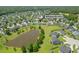 Aerial view of neighborhood with pond and well-maintained homes at 5032 Ballantine Drive at 5032 Ballantine Dr, Summerville, SC 29485