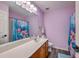Bathroom with a large mirror, single sink, and blue floral shower curtain add a pop of color to the space at 5032 Ballantine Dr, Summerville, SC 29485