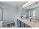 Bathroom features a double sink vanity, a walk-in shower and a tub with bright, natural lighting at 5032 Ballantine Dr, Summerville, SC 29485