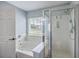Bright bathroom featuring a walk-in shower, a soaking tub and a large window for natural lighting at 5032 Ballantine Dr, Summerville, SC 29485