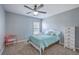 Bright bedroom with a ceiling fan, gray walls, and natural light from the window create a serene atmosphere at 5032 Ballantine Dr, Summerville, SC 29485