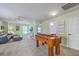 Upstairs bonus room featuring a foosball table, neutral walls, carpet floors, TV and comfortable seating at 5032 Ballantine Dr, Summerville, SC 29485