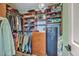 Organized walk-in closet with wood shelving, hanging rods, drawers, and plenty of storage space at 5032 Ballantine Dr, Summerville, SC 29485