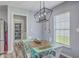 Charming dining area with weathered table and stylish pendant lighting next to kitchen at 5032 Ballantine Dr, Summerville, SC 29485