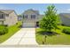 Charming two-story home with a well-manicured lawn and a two-car garage, providing ample parking at 5032 Ballantine Dr, Summerville, SC 29485