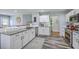 Bright kitchen with white cabinets, granite countertops, and stainless appliances at 5032 Ballantine Dr, Summerville, SC 29485