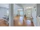 Bright, open-concept living space with hardwood floors and plenty of natural light from the large windows at 5032 Ballantine Dr, Summerville, SC 29485