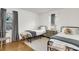 Cozy bedroom featuring two twin beds, neutral decor, and hardwood floors at 5075 Walker St, North Charleston, SC 29405