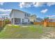 Large backyard with lush grass, a playset, and a privacy fence at 508 Alderly Dr, Moncks Corner, SC 29461