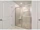 Bright bathroom features a glass enclosed shower with a tiled surround and mosaic tile floor at 508 Alderly Dr, Moncks Corner, SC 29461