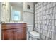 Bathroom with dual sink vanity, wood cabinets, large mirror, and a view to the next room at 508 Alderly Dr, Moncks Corner, SC 29461