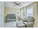 Bedroom with crib, rocking chair, ottoman, side table, and two windows for natural light at 508 Alderly Dr, Moncks Corner, SC 29461