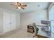 Bright bedroom with ceiling fan, closet with double doors, computer desk, and window for natural light at 508 Alderly Dr, Moncks Corner, SC 29461