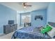 Blue bedroom features a ceiling fan, bed with game themed bedding, dresser, and a window at 508 Alderly Dr, Moncks Corner, SC 29461