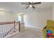 Upstairs bonus room area with neutral carpet and a ceiling fan at 508 Alderly Dr, Moncks Corner, SC 29461