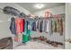 Walk-in closet with wire shelving, hanging clothes, storage containers, shoes, and luggage provides ample storage at 508 Alderly Dr, Moncks Corner, SC 29461