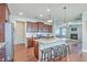 Gourmet kitchen with a large island, stainless steel appliances, and opens to the living room with a fireplace at 508 Alderly Dr, Moncks Corner, SC 29461