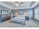 Comfortable main bedroom with tray ceiling, stylish decor, and a ceiling fan for added comfort at 508 Alderly Dr, Moncks Corner, SC 29461
