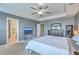 Spacious main bedroom featuring a ceiling fan, bedside tables and lamps, and large TV at 508 Alderly Dr, Moncks Corner, SC 29461