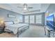 Serene main bedroom suite with natural light, ceiling fan and a large TV at 508 Alderly Dr, Moncks Corner, SC 29461