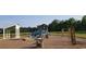 Community playground featuring a colorful playset, swings, and a covered picnic area at 508 Alderly Dr, Moncks Corner, SC 29461