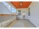 Cozy screened porch with wooden ceiling and rocking chair; ideal for relaxing at 508 Alderly Dr, Moncks Corner, SC 29461