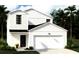 Charming two-story home featuring white siding, a front-facing garage, and a well-manicured lawn at 511 Kitsap Ct, Summerville, SC 29486