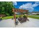 Backyard with outdoor dining and seating, featuring a pergola and landscaped lawn with healthy grass at 511 Nandina Dr, Goose Creek, SC 29445