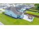 Aerial of a well-maintained backyard with a patio, pergola, outdoor furniture, and lush green lawn at 511 Nandina Dr, Goose Creek, SC 29445