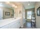 Bathroom with double sink vanity, large mirror, and a doorway leading to toilet at 511 Nandina Dr, Goose Creek, SC 29445
