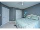 Bedroom features a patterned bed, white doors, and serene gray walls at 511 Nandina Dr, Goose Creek, SC 29445