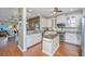 Bright, open kitchen with white cabinetry, granite countertops, stainless steel appliances, and a center island at 511 Nandina Dr, Goose Creek, SC 29445