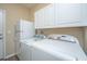 Well lit laundry room with lots of storage space, featuring a washer and dryer for convenience at 511 Nandina Dr, Goose Creek, SC 29445